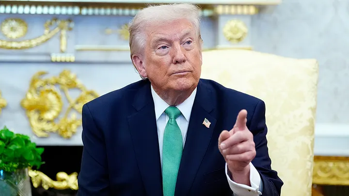 President Donald Trump takes questions from reporters during a meeting with Irish Prime Minister Miche&aacute;l Martin in the Oval Office of the White House, on St. Patrick's Day, Tuesday, March 17, 2026, in Washington.  (AP Photo/Alex Brandon)