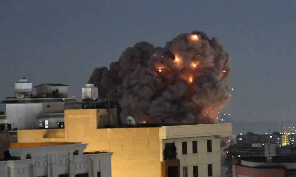 Smoke billows from a Tehran residential area following a March 29 strike. Xinhua/Shutterstock