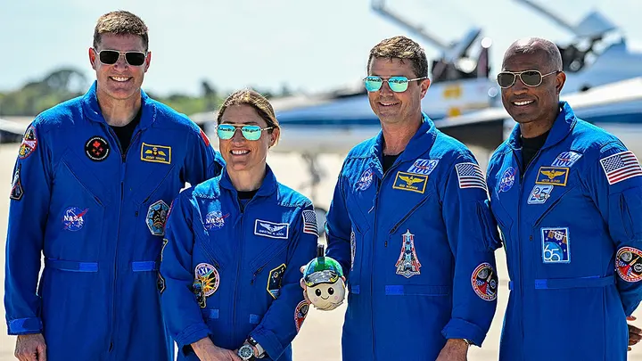 Astronauts Jeremy Hansen, Christina Koch, Reid Wiseman, and Victor Glover attend a welcome ceremony at Kennedy Space Center in Florida on March 27, 2026, ahead of the Artemis II mission launch scheduled for April 1, 2026. (Miguel J. Rodriguez Carrillo/AFP)