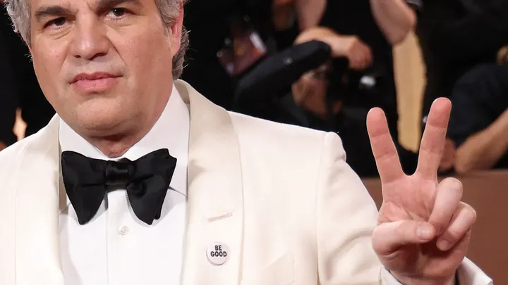 Mark Ruffalo US wears a pin reading "be Good", in tribute to Renee Good, at the 83rd annual Golden Globe Awards. ( Michael Tran / AFP via Getty Images)