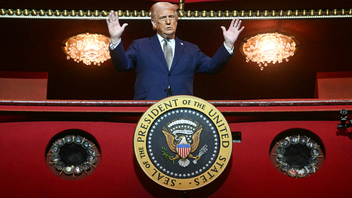 President Donald Trump stands in the presidential box during a tour of the John F. Kennedy Center for the Performing Arts in Washington, D.C., on March 17, 2025. On Friday, a federal judge ruled that Trump's name must be removed from he iconic venue. (Jim Watson/AFP/Getty Images)