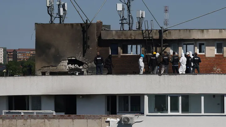Romanian law enforcement officers work at the site of an explosion in a residential block of flats following a reported drone strike near the border with Ukraine, in Galati, Romania, May 29, 2026.  (Inquam Photos/George Calin via Reuters)