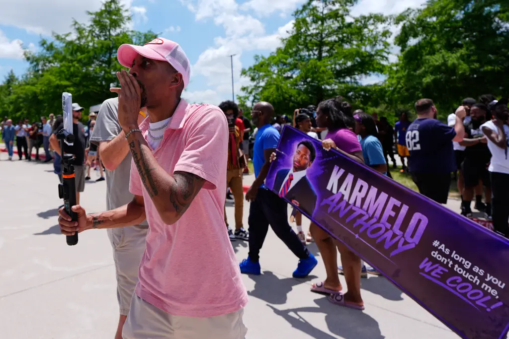 A person announcing the guilty verdict in front of a crowd of Anthony supporters at Collin County courthouse. AP Photo/Tony Gutierrez