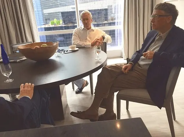Epstein (left) and Gates during an apparent meeting. DOJ