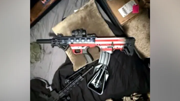 Tycen Proper allegedly acquired an AR-style rifle and a bullpup rifle painted with the American flag, officials said. (Department of Justice)