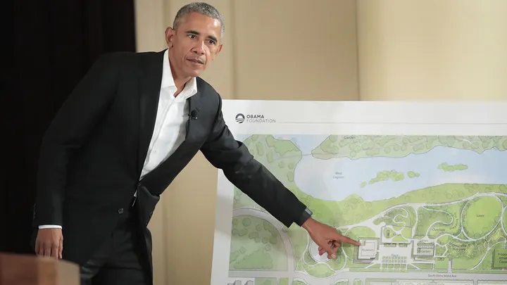 Former President Barack Obama points out features of the proposed Obama Presidential Center during a gathering at the South Shore Cultural Center in Chicago, Illinois, on May 3, 2017. (Scott Olson/Getty Images)