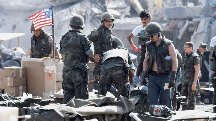 American Marines search for survivors and bodies in the rubble of their barracks headquarters in Beirut, Lebanon, after a suicide car bomb killed 241 U.S. servicemen and wounded over 60 on Oct. 24, 1983. (Peter Charlesworth/LightRocket)
